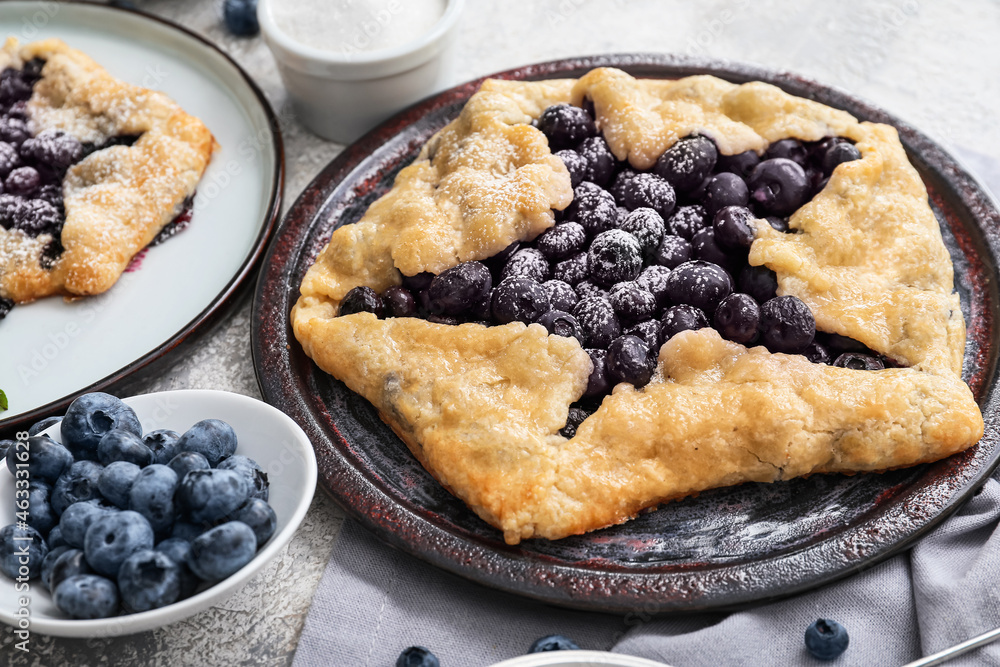 Plate with tasty blueberry galette on table, closeup Plate with tasty blueberry galette on table, closeup