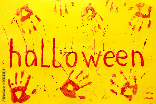 Bloody palm prints and text...