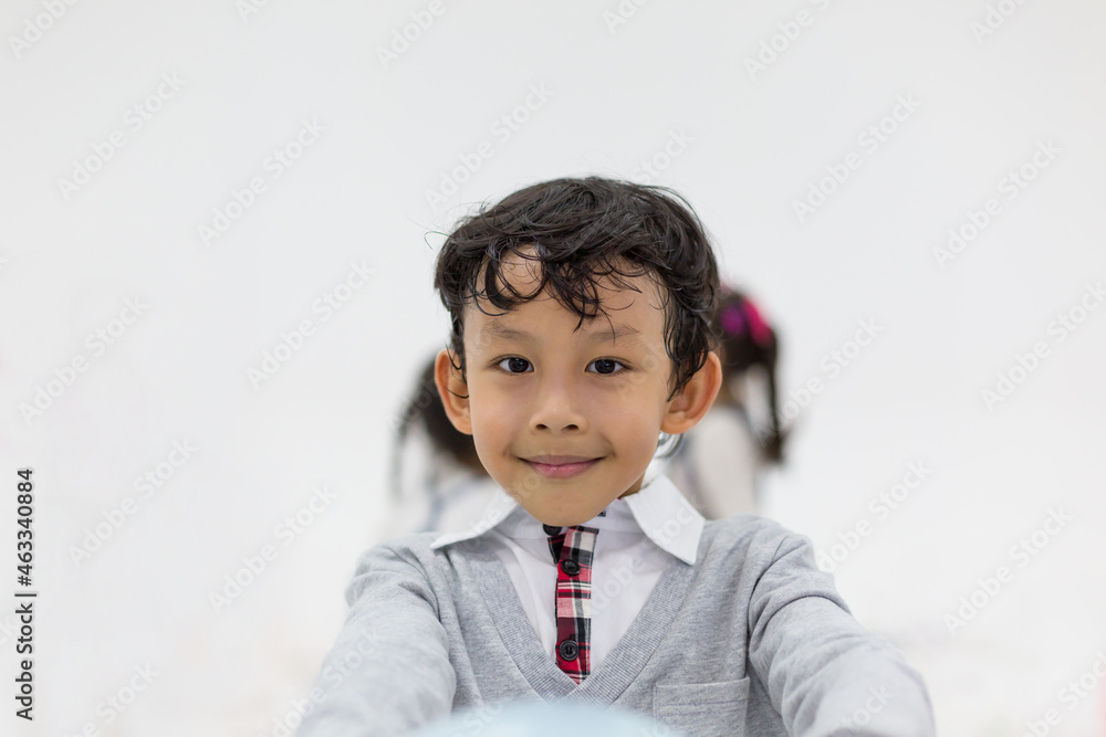 Cute Asian little boy playing balloon in the nursery school with happy and smile Cute Asian little boy playing balloon in the nursery school with happy and smile