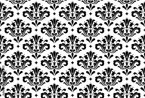 Wallpaper in the style of Baroque. Seamless vector background. White and black floral ornament. Graphic pattern for fabric, wallpaper, packaging. Ornate Damask flower ornament