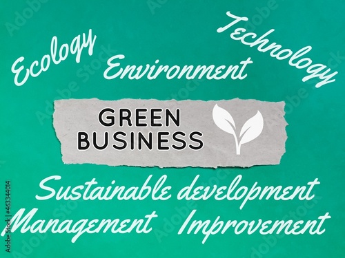 Green business written on paper strip with keywords.