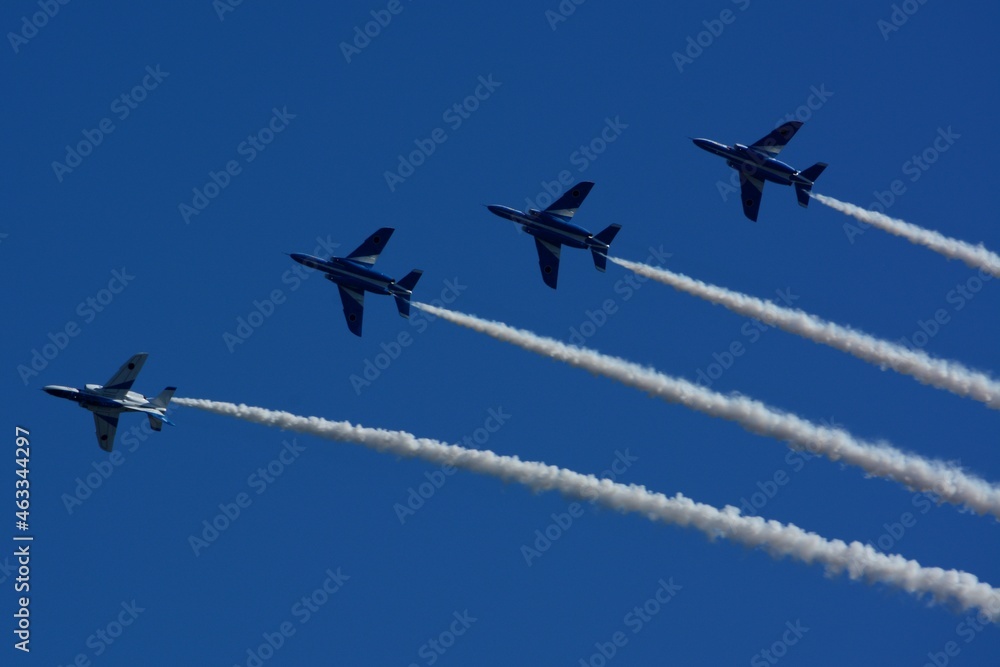 JASDF aerobatic team Blue Impulse flying in deep blue sky JASDF aerobatic team Blue Impulse flying in deep blue sky