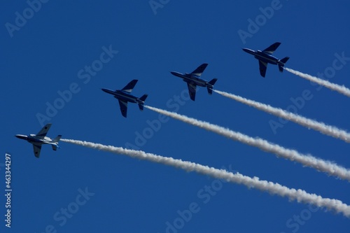 JASDF aerobatic team Blue Impulse flying in deep blue sky