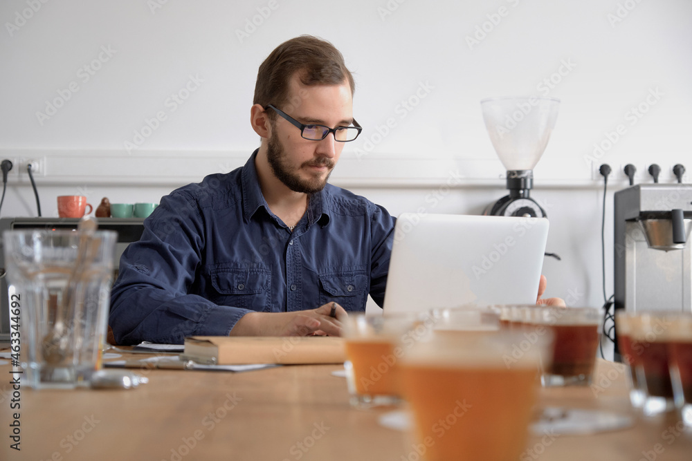 Man with laptop at coffee shop Man with laptop at coffee shop
