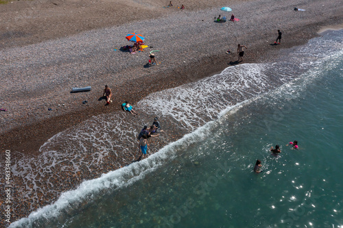 people swimming on the beach during vacation, cide, turkey photo