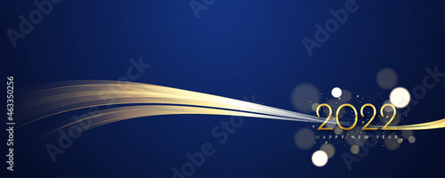 The elegant new year 2022 background. 2022 calendar header with shiny golden line waves and glitter particles on dark blue background