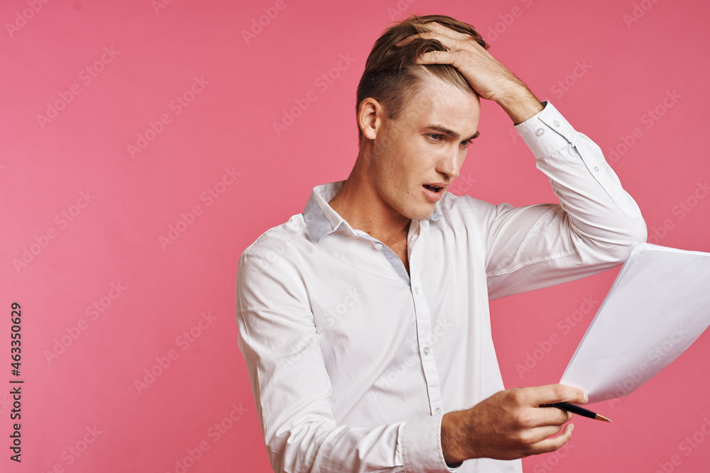 businessmen reading documents in hand pink background businessmen reading documents in hand pink background