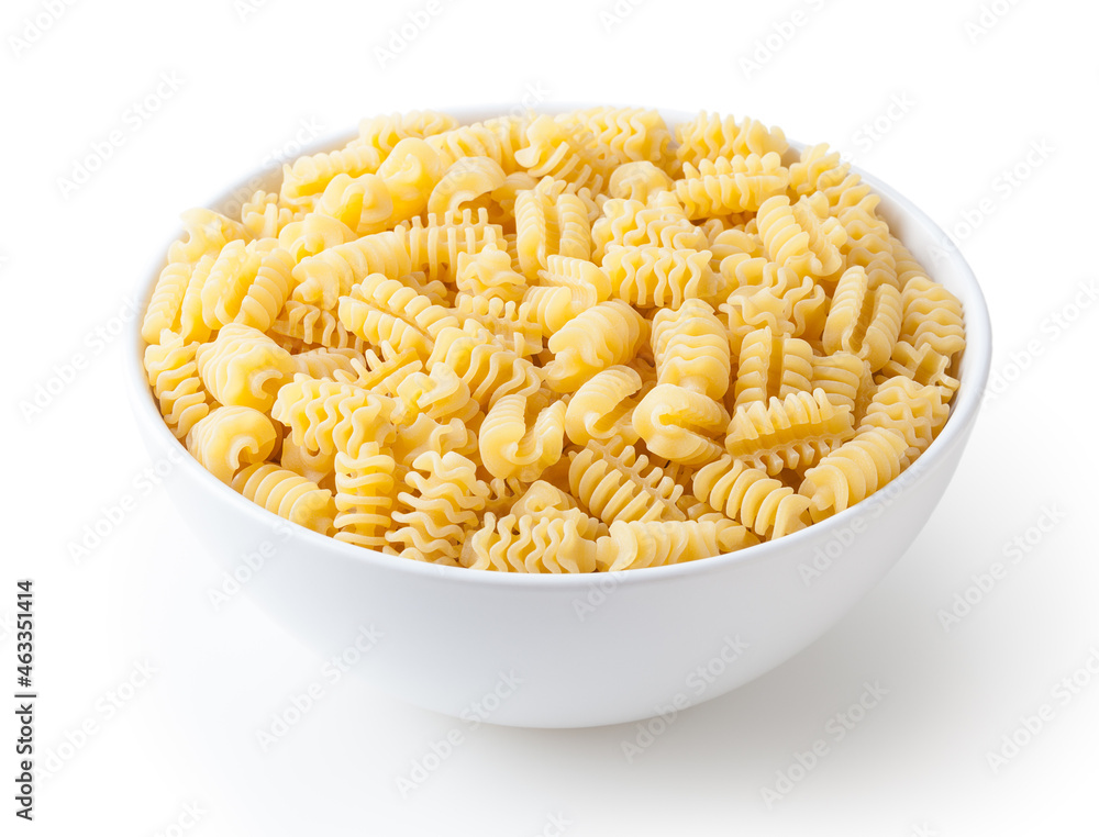 Uncooked radiatori pasta in white ceramic bowl isolated on white background with clipping path Uncooked radiatori pasta in white ceramic bowl isolated on white background with clipping path