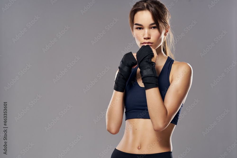 athletic woman boxing workout exercises fitness posing dark background - obrazy, fototapety, plakaty 