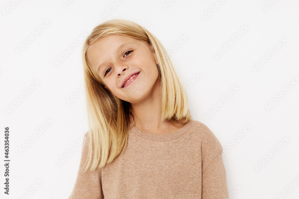 Positive little girl blank space for logo design on a light background Positive little girl blank space for logo design on a light background