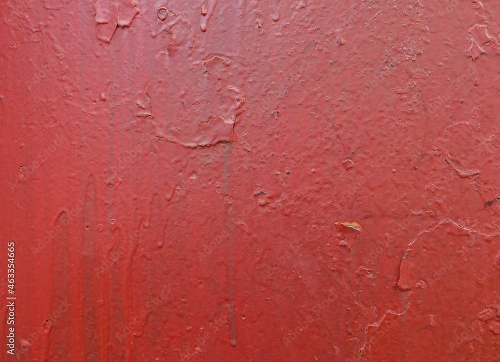 An abstract background of dripping red paint on the wall. An abstract background of dripping red paint on the wall.