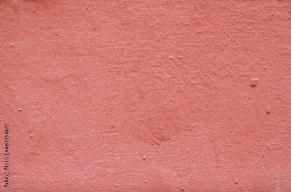 Fototapeta premium Abstract background from red old plaster on the wall.