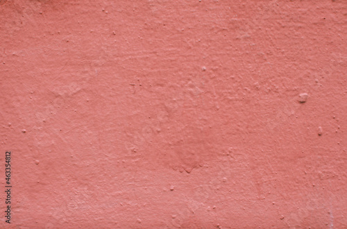 Abstract background from red old plaster on the wall.