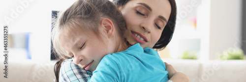 Canvastavla Little girl hugs together with her mother in gentle embrace