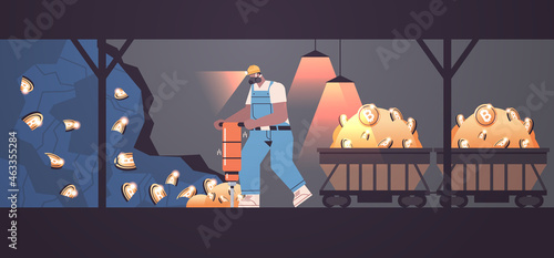 man miner digging and extracting bitcoins in mine cave mining crypto coins digital cryptocurrency blockchain