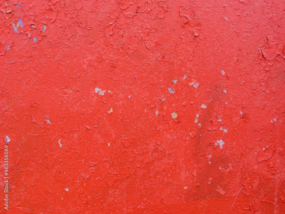 Abstract background of time-damaged paint on wall.