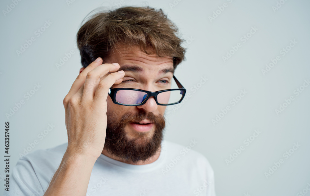 bearded man vision problems in white t-shirt isolated background bearded man vision problems in white t-shirt isolated background
