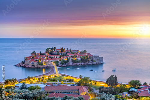 view of beauty sunset over Sveti Stefan, small islet and resort in Montenegro. Balkans, Adriatic sea, Europe.
