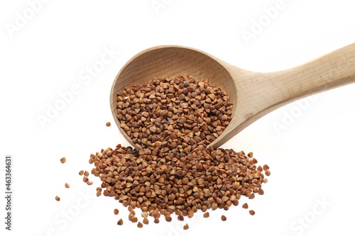  Buckwheat seed pile with wooden spoon isolated on white  