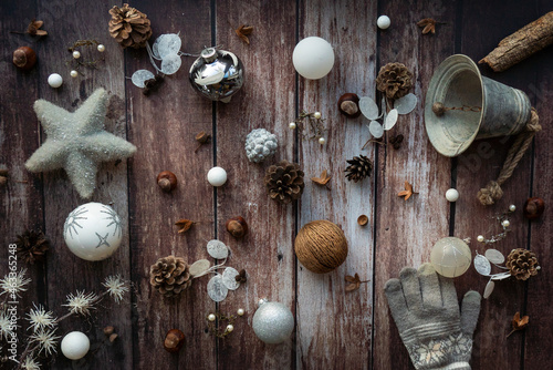 christmas decorations on a rustic, old wooden background, flat lay vintage style