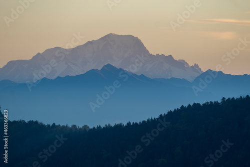 Fototapeta Naklejka Na Ścianę i Meble -  mountains in the fog during sunrise, Mont Blanc in the Background