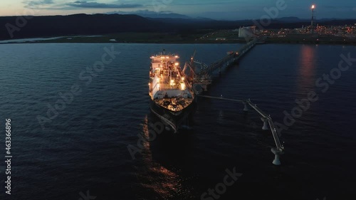On a summer day, huge tankers are refueled with gas in the south of Sakhalin Island from an LNG plant for transportation to other countries.