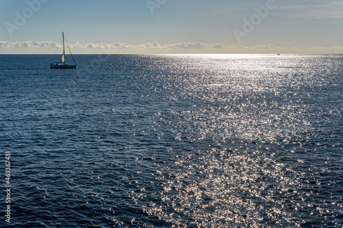 Seascape of the Mediterranean Sea at sunrise with a ship sailing in its waters. Sublime landscape of a sunrise from the island of Mallorca, Spain © Nemesio