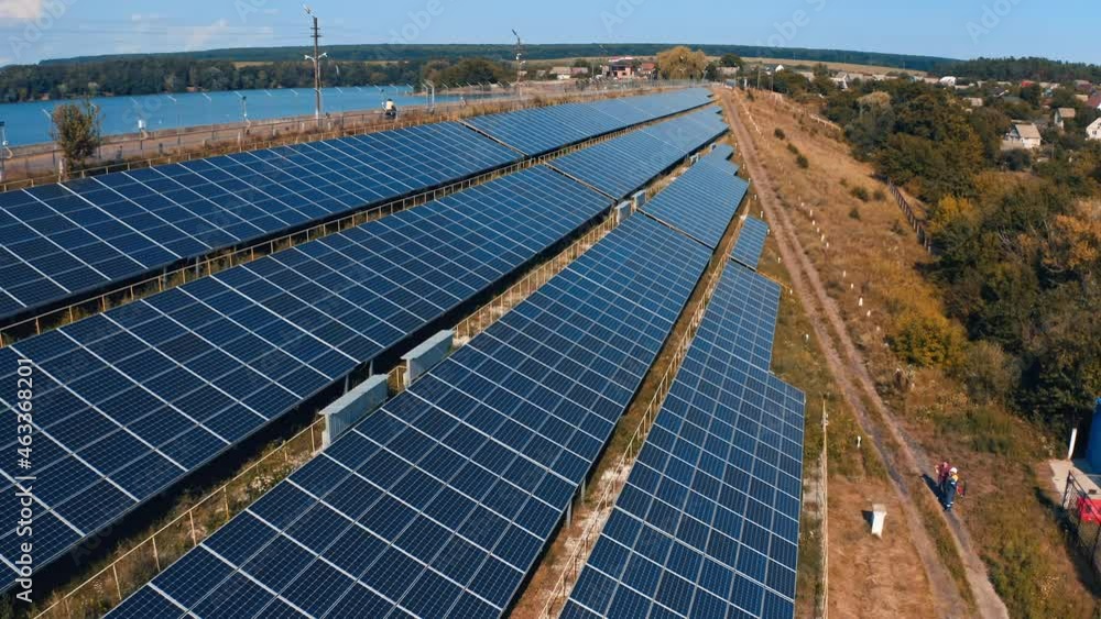 Solar panels in the countryside. Blue photovoltaic panels get clean energy from the sun. Electricity innovations. Aerial view. Solar panels in the countryside. Blue photovoltaic panels get clean energy from the sun. Electricity innovations. Aerial view.