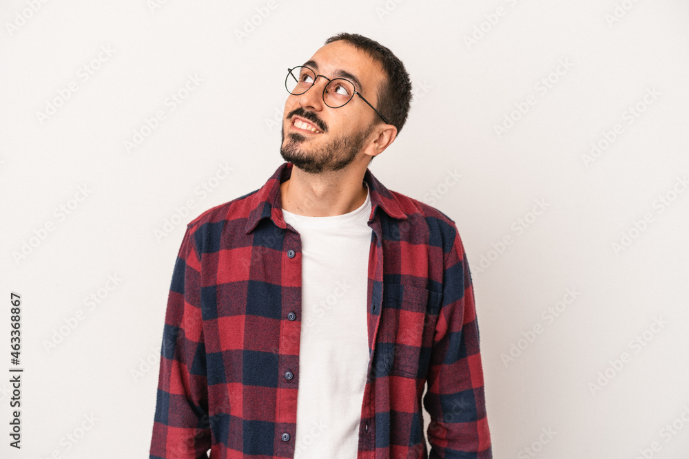 Young caucasian man isolated on white background relaxed and happy laughing, neck stretched showing teeth. Young caucasian man isolated on white background relaxed and happy laughing, neck stretched showing teeth.