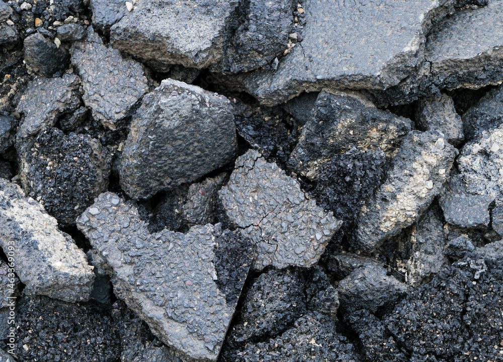 Broken dark asphalt pieces close up shot, image for industrial background. Broken dark asphalt pieces close up shot, image for industrial background.