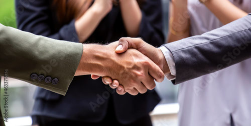 The banner of  successful Businesspeople team work which handshake and Success concept of handshaking after good deal while the greeting of friendship in the office background © SASITHORN