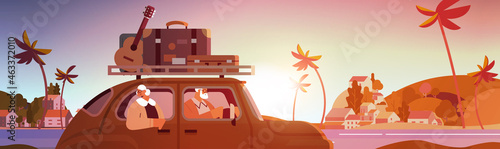 old family driving in car on weekly holiday senior travelers couple traveling by active old age concept