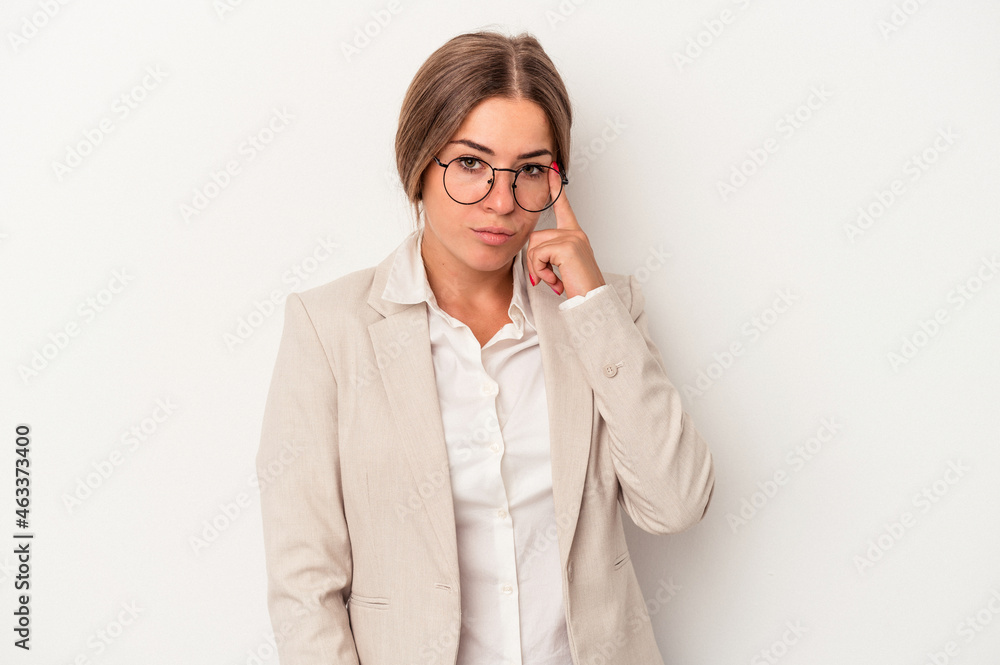 Young Russian business woman isolated on white background pointing temple with finger, thinking, focused on a task. Young Russian business woman isolated on white background pointing temple with finger, thinking, focused on a task.