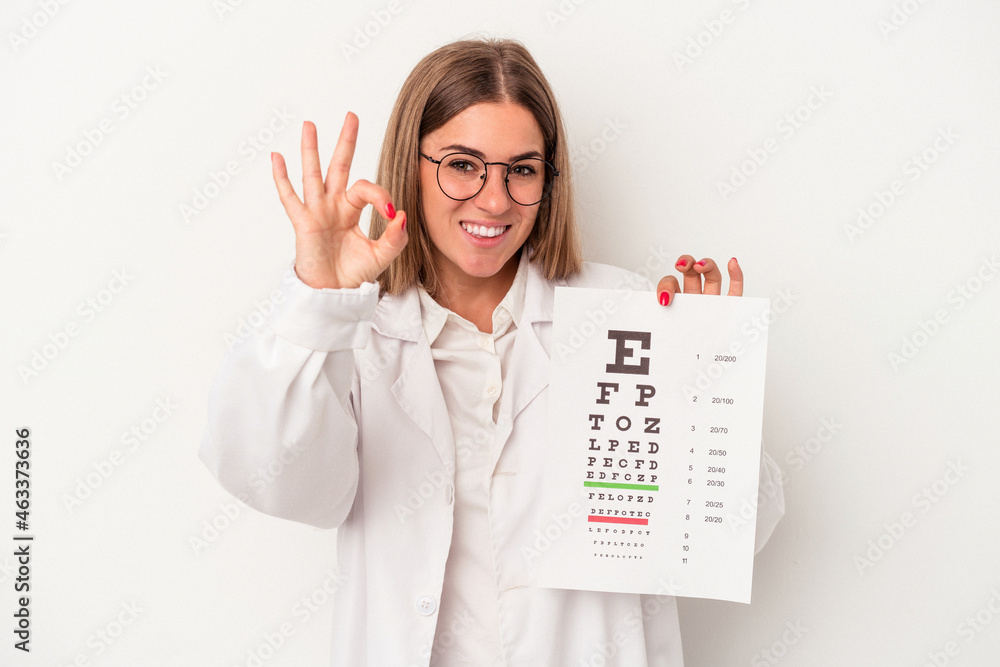 Young optometrist Russian woman isolated on white background cheerful and confident showing ok gesture. Young optometrist Russian woman isolated on white background cheerful and confident showing ok gesture.
