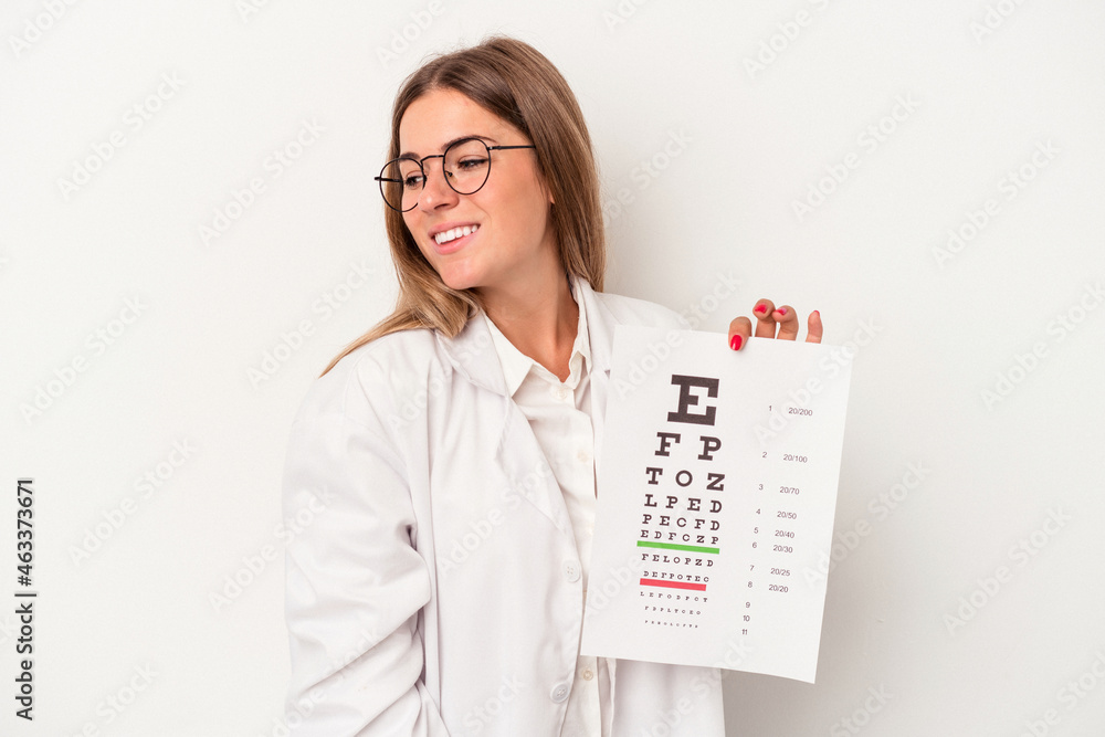Young optometrist Russian woman isolated on white background looks aside smiling, cheerful and pleasant. Young optometrist Russian woman isolated on white background looks aside smiling, cheerful and pleasant.
