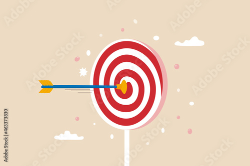 Aiming for children education target, parenting or kid knowledge or skill, humor business target or achievement concept, bow arrow children toy with suction cup hit sweet lollypop bullseye target.