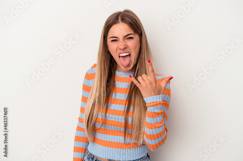 Young Russian woman isolated on white background showing rock gesture with fingers