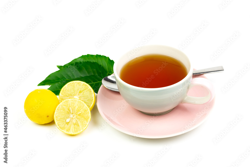 Neem tea in ceramic cup with neem leaf and lemon isolated on white background.