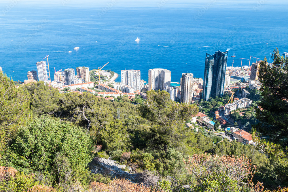 Obraz premium Aerial view of Monaco with skyscrapers and blue sea