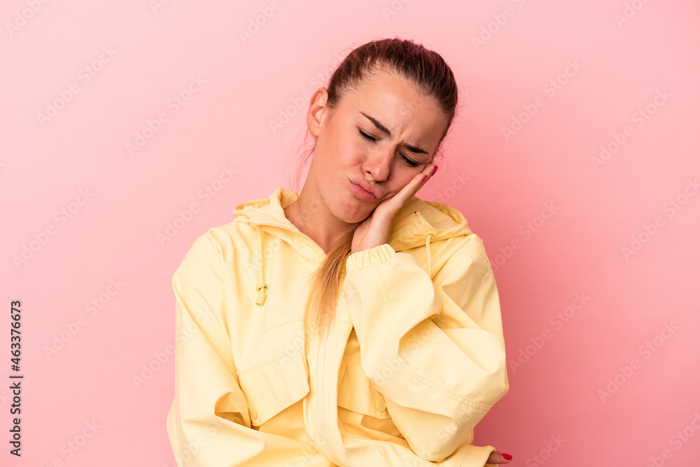 Young Russian woman isolated on pink background who is bored, fatigued and need a relax day.