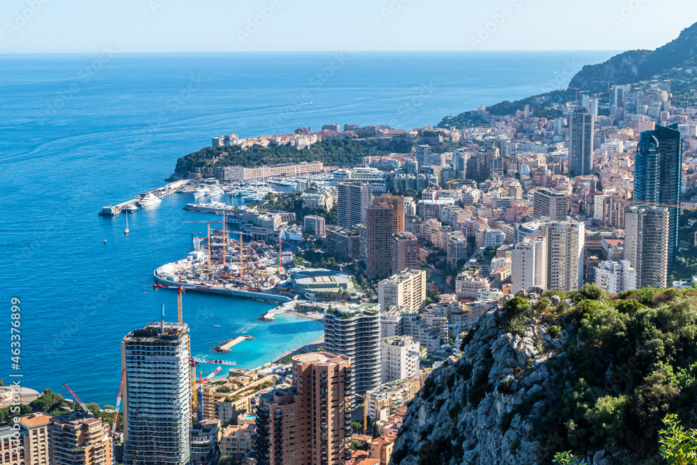 Fototapeta premium Aerial view of Monaco with skyscrapers and blue sea