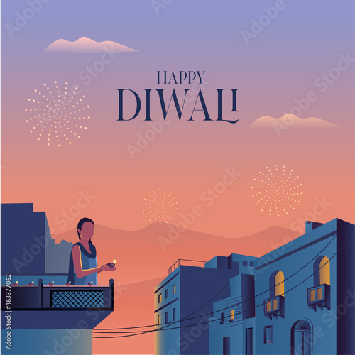 Women holding diya in terrace deepawali greeting
