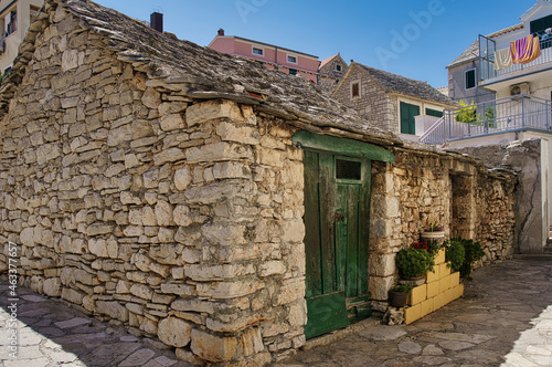 barn in the yard of a house in a Croatian village