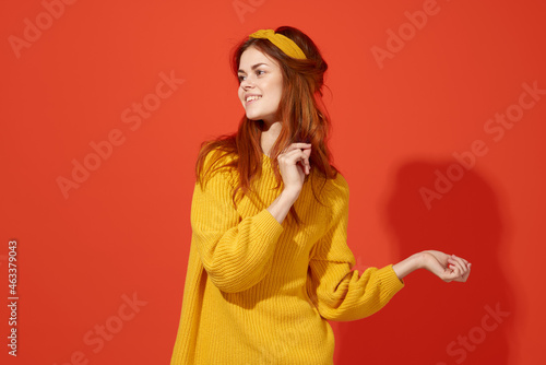 cheerful woman in yellow sweater hipster clothes studio fashion lifestyle