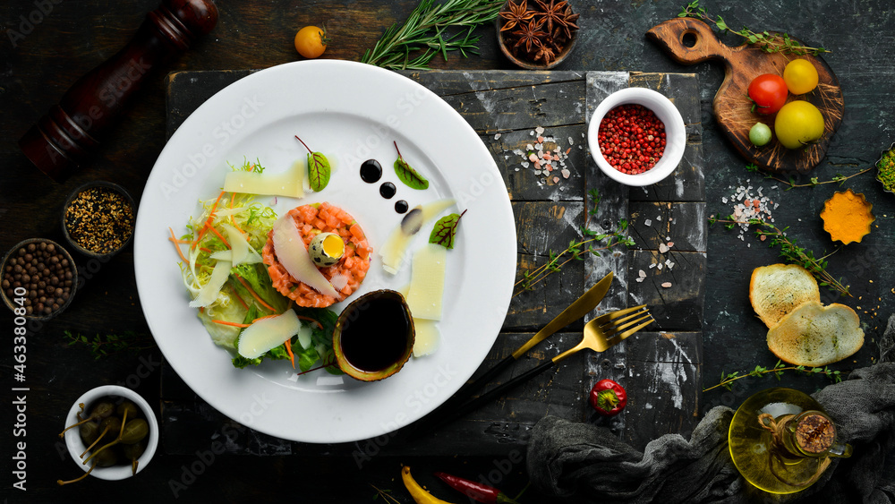 Salmon tartare: Raw salmon, avocado purple onion. Top view. Food. Rustic style. Salmon tartare: Raw salmon, avocado purple onion. Top view. Food. Rustic style.