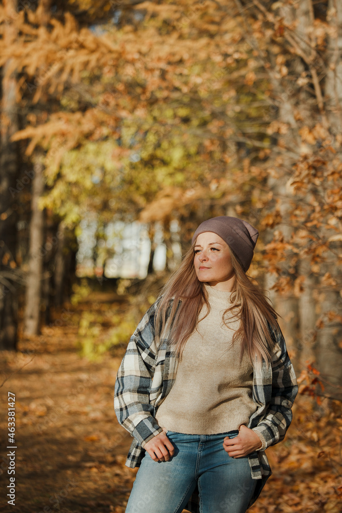 a blonde girl in a plaid shirt in the autumn forest a blonde girl in a plaid shirt in the autumn forest