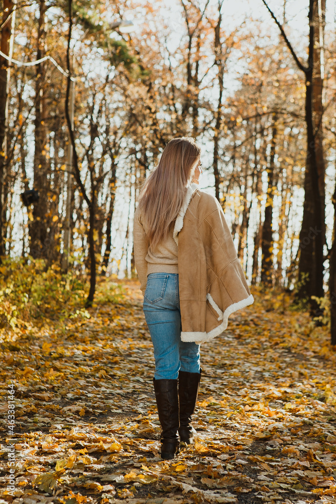 a blonde adult girl walks in the autumn forest. a walk in the fresh air alone
a blonde adult girl walks in the autumn forest. a walk in the fresh air alone