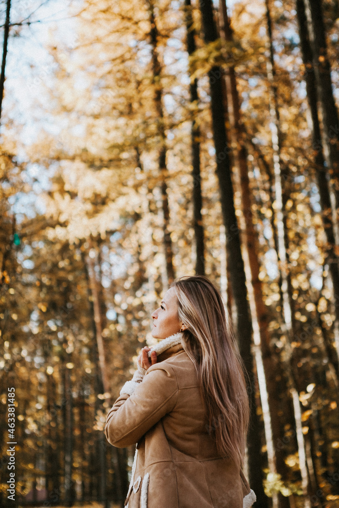 a blonde adult girl walks in the autumn forest. a walk in the fresh air alone
a blonde adult girl walks in the autumn forest. a walk in the fresh air alone