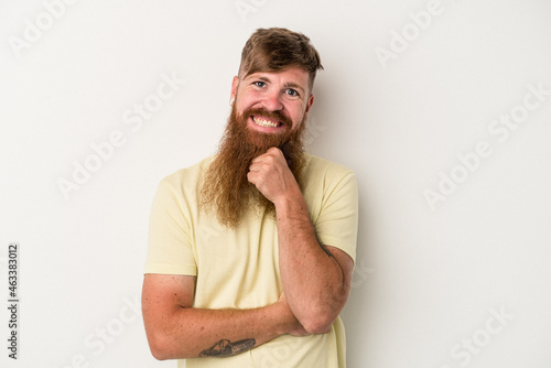 Young caucasian ginger man with long beard isolated on white background smiling happy and confident, touching chin with hand.