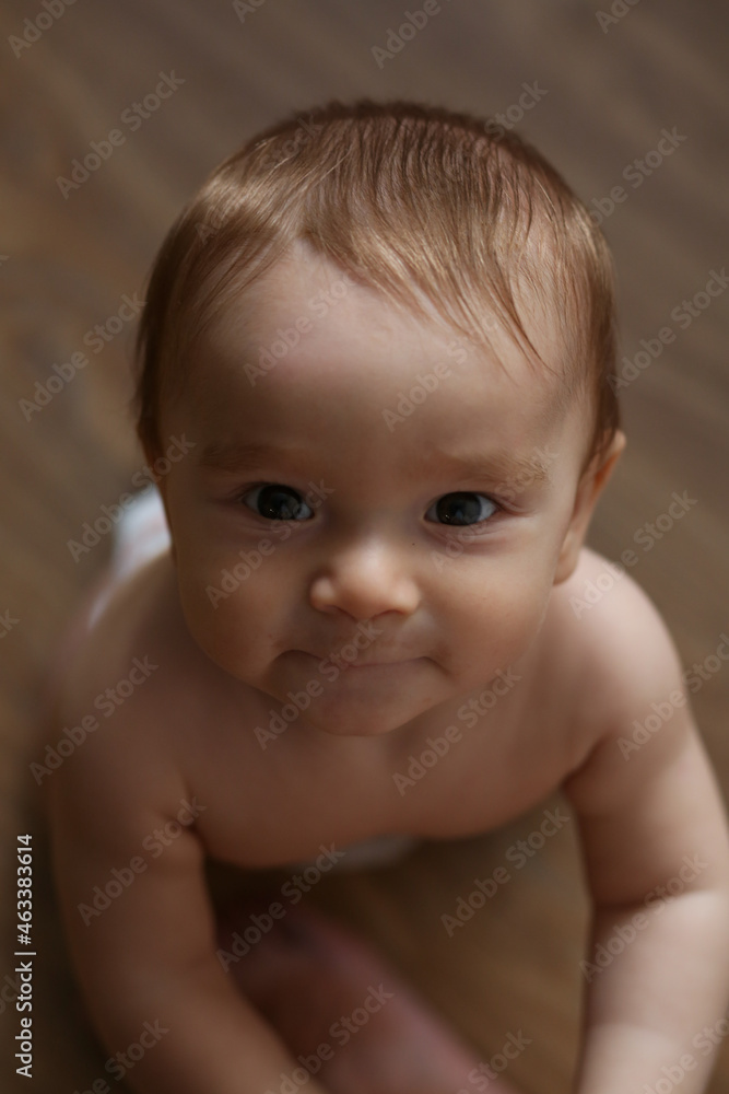 Adorable little baby boy crawling on the floor. Adorable little baby boy crawling on the floor.